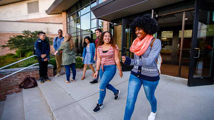 Calvin students walking out of the Covenant Fine Arts Center on campus in Grand Rapids, Michigan